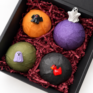 4 pack bath bombs in box with toys on top