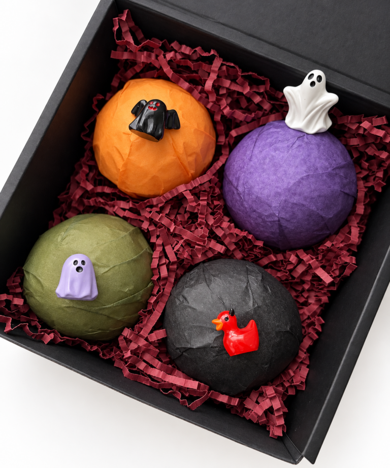 4 pack bath bombs in box with toys on top