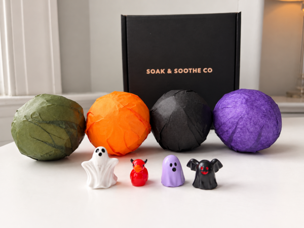 4 pack bath bombs with toys in front