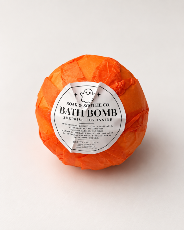 Single Halloween Bath Bomb w toy orange up close